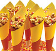 Candy corn wrapped in paper cones