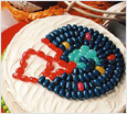 cake topped with jelly beans in the shape of a football helmet